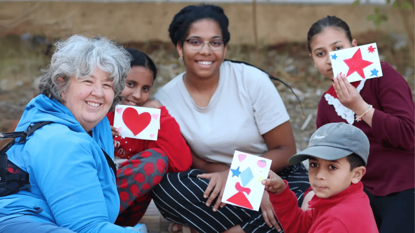 DTS students playing with kids on outreach